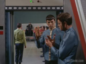 Spock shows McCoy how to do the Vulcan salute